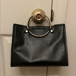 Elegant Black Handbag with Gold Accents